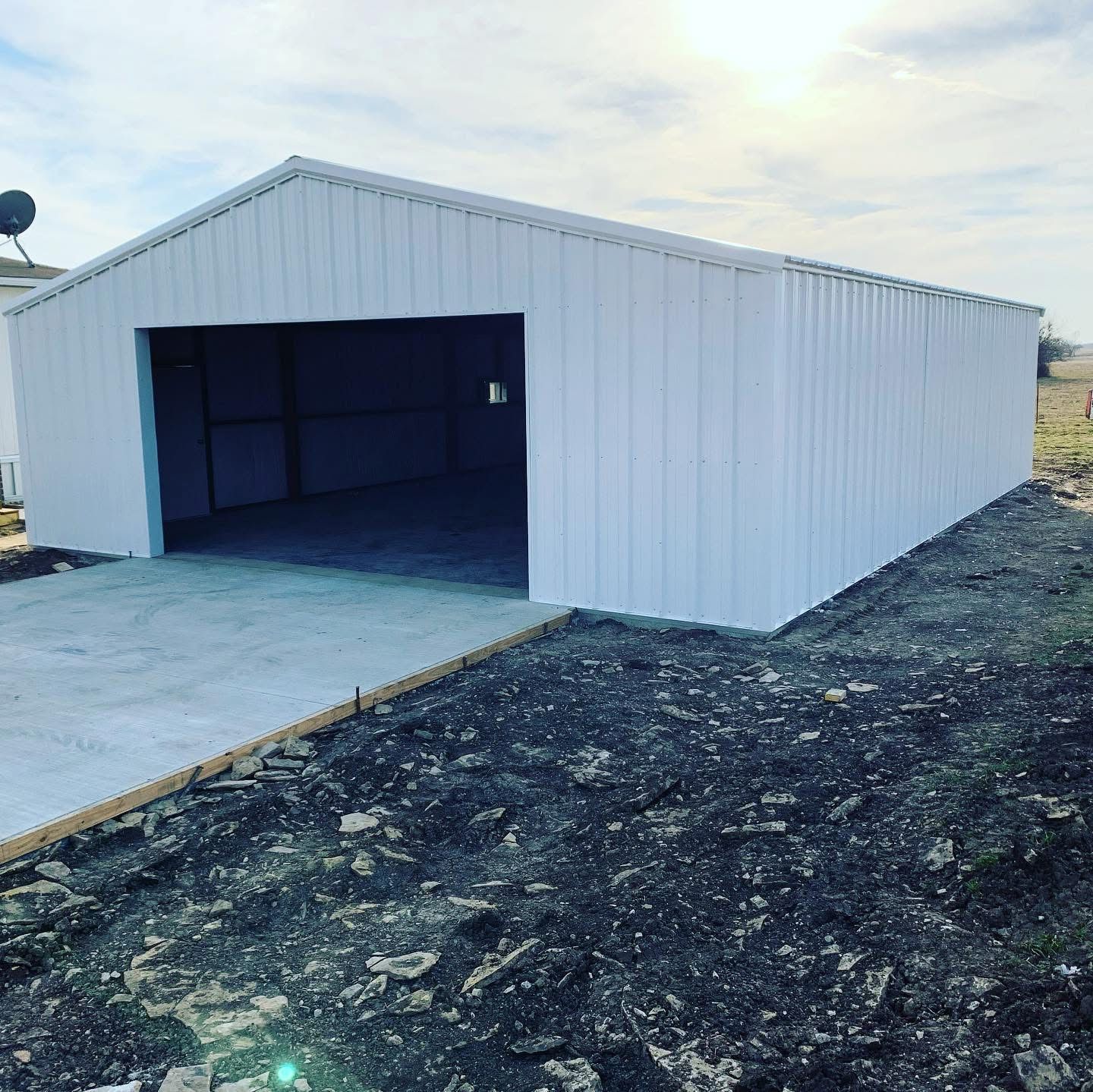New metal shop building with a large overhead door