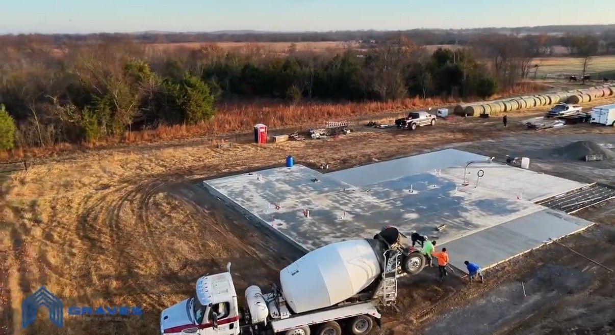 Aerial view of a concrete slab being poured for a new home