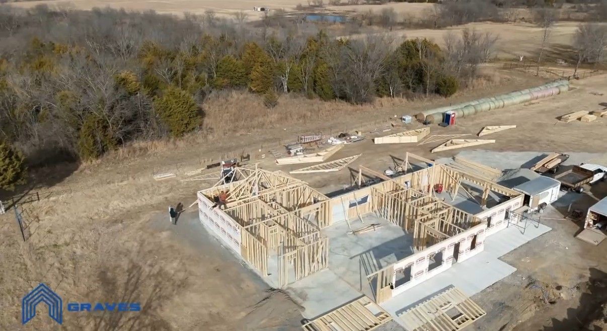 Aerial view of wall framing and trusses going up