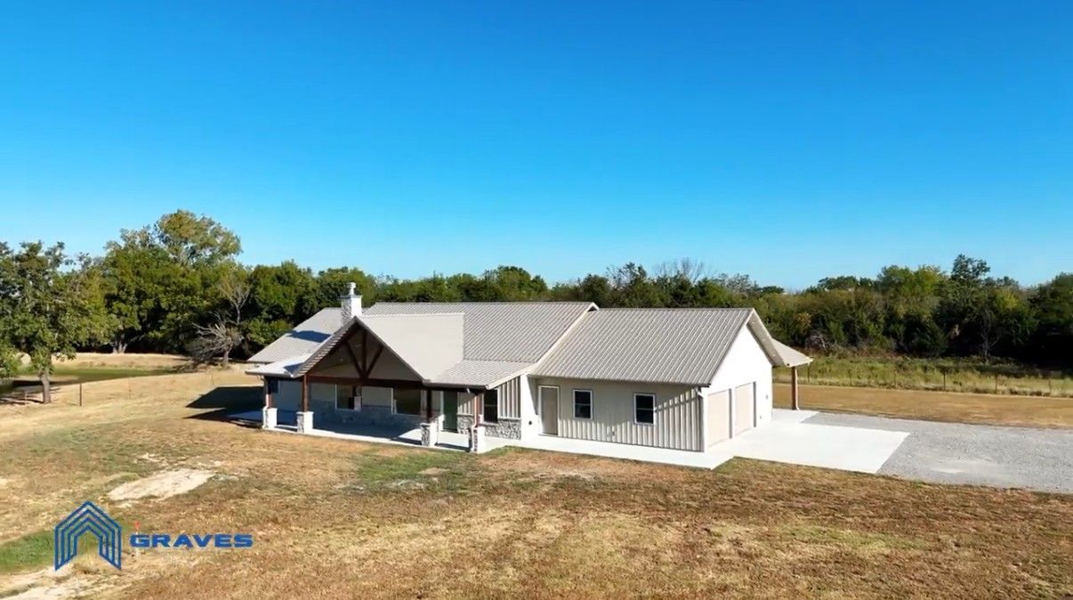 Aerial view of the finished home with attached garage